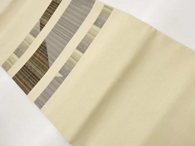 Hand woven tsumugi tsumugi nagoya obi, woven with horizontal stripes in a kurime